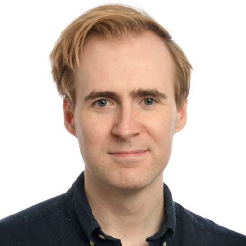A headshot of Thom Rawson